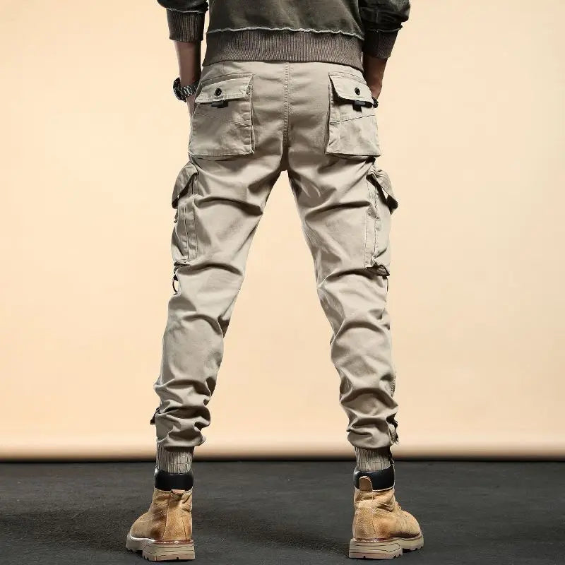 Pantalones cargo ajustados de primavera y otoño 2024 de mezcla de algodón con cordón y cremallera informales para hombre de moda coreana