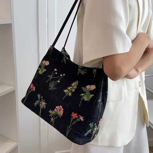 Bolso de mano bordado de gran capacidad para mujer Nuevo bolso de tela de moda Bolso de hombro Bolso cubo con textura de flores negras